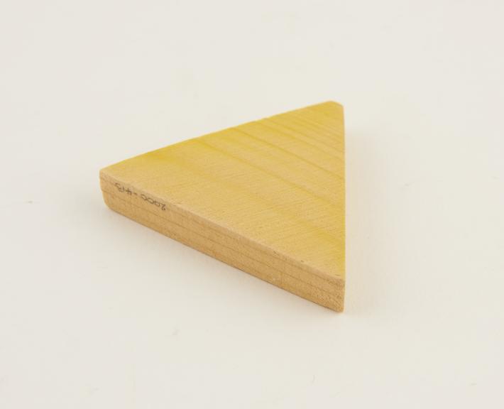 Wooden triangle, stained yellow