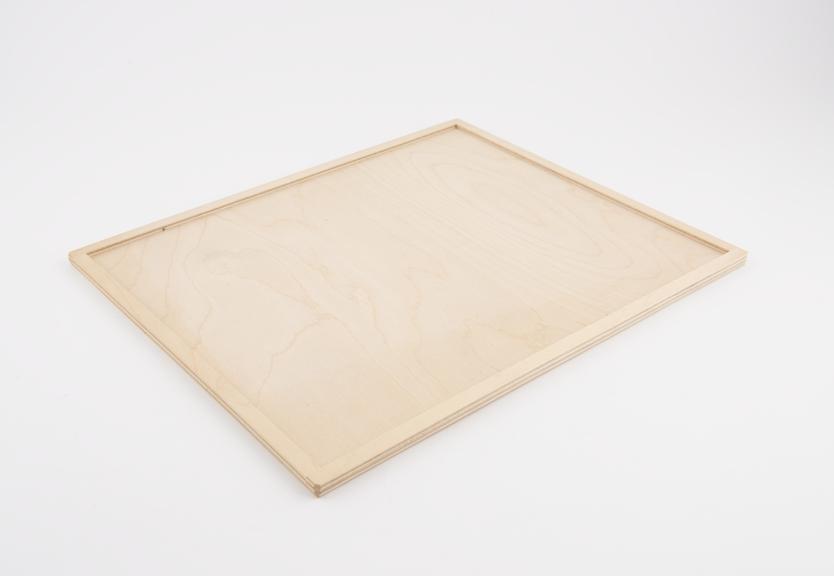 Plywood tray for use with a set of Lowenfeld mosaics