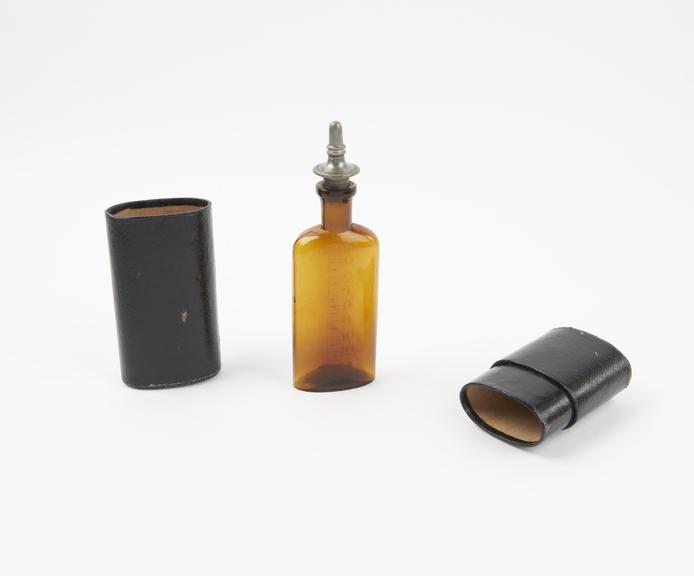 Mills type graduated chloroform drop bottle, in leather case