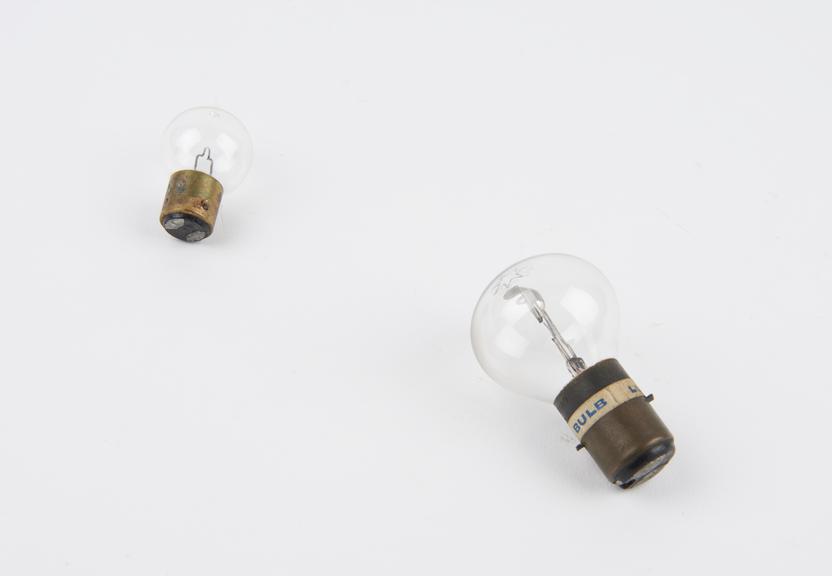 Two motor car lamp bulbs, in a box.