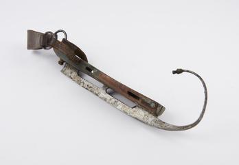 One of a pair of wood, leather and metal ice skates