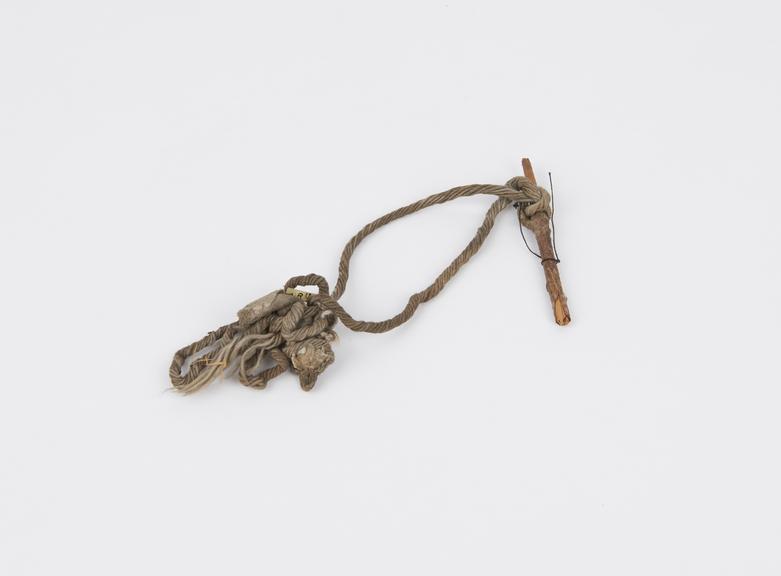 Cotton bootlace wound round a small twig, from St