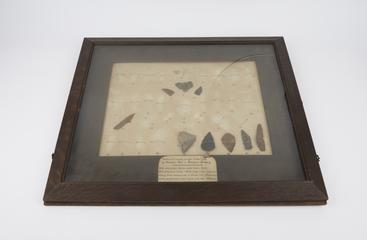 Neolithic flint implements in frame