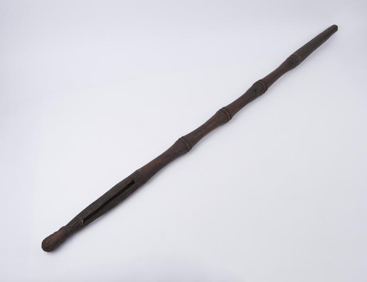 Carved wooden staff, with rattle incoporated into top