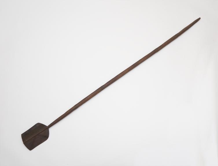 Carved wooden staff, ceremonial, in the form of a paddle