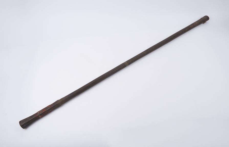 Heavy black carved wooden stick