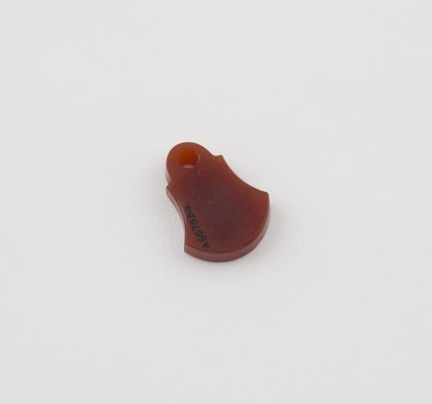 Amuletic polished cornelian pendant, roughly bell-shaped