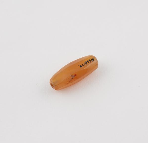 Amulet consisting of polished cornelian bead