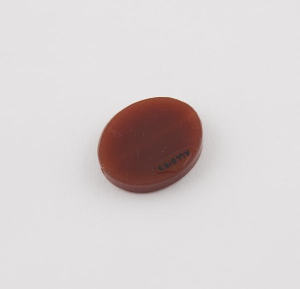 Amuletic oval cornelian disc-shaped bead