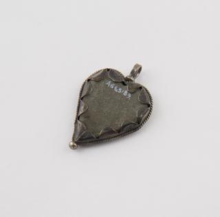 Flat grey stone heart pendant in silver mount