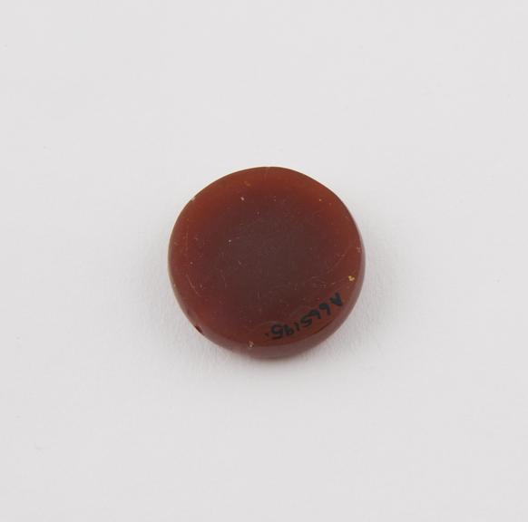 Amuletic cornelian bead, disc-shaped, De Mortillet collection