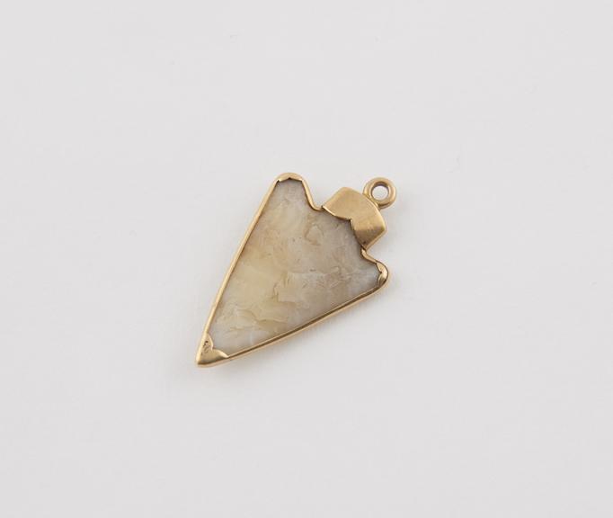 Quartz arrowhead in gold mount, ring for suspension