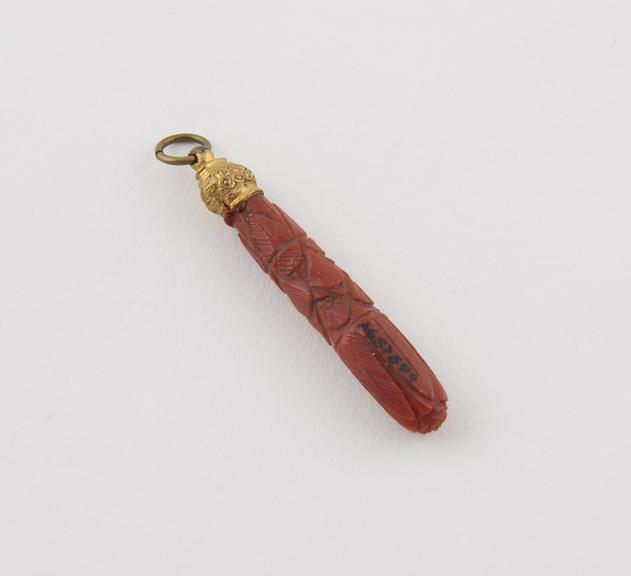 Coral amulet, brass mounted, suspension ring