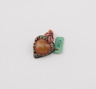 Amuletic pendant, orange stone in metal heart-shaped setting