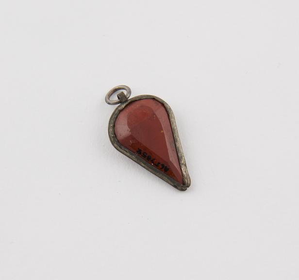 Amuletic pendant in form of jasper heart set in silver mount