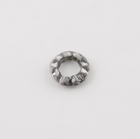 Cast metal alloy ring amulet, with pyramidal excrescences