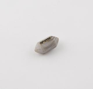 Onyx(?) bead, grey and white streaked, multi-facet