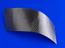 Curved sample of carbon-fibre-reinforced shape-memory polymer