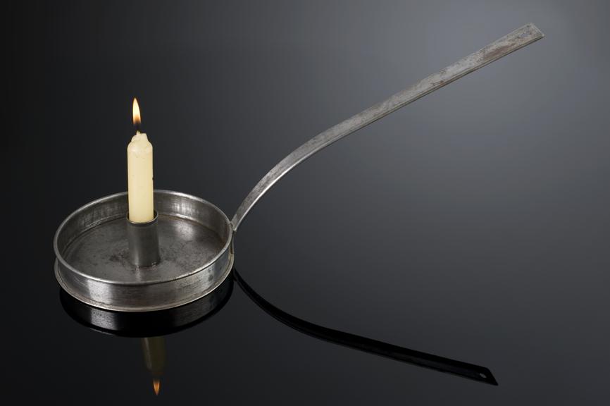 Pewter candlestick with long handle