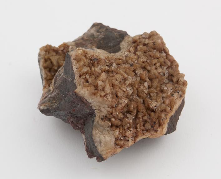 Crystalline chalybite formed on the surface and fissures of a