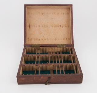 Wooden box made to hold 48 discs of colour matching test and 16 spare yellow discs