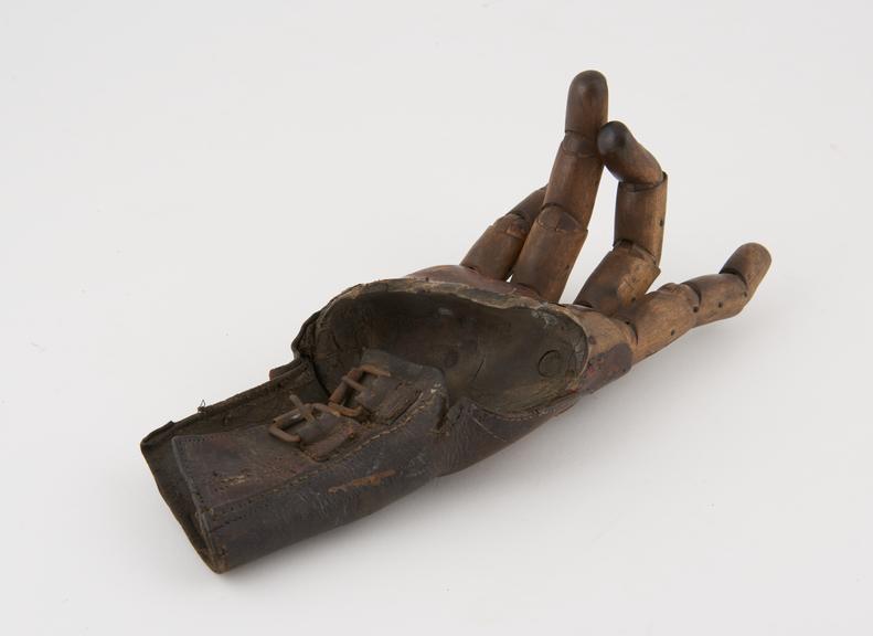 Artificial right hand, wood and leather, probably English