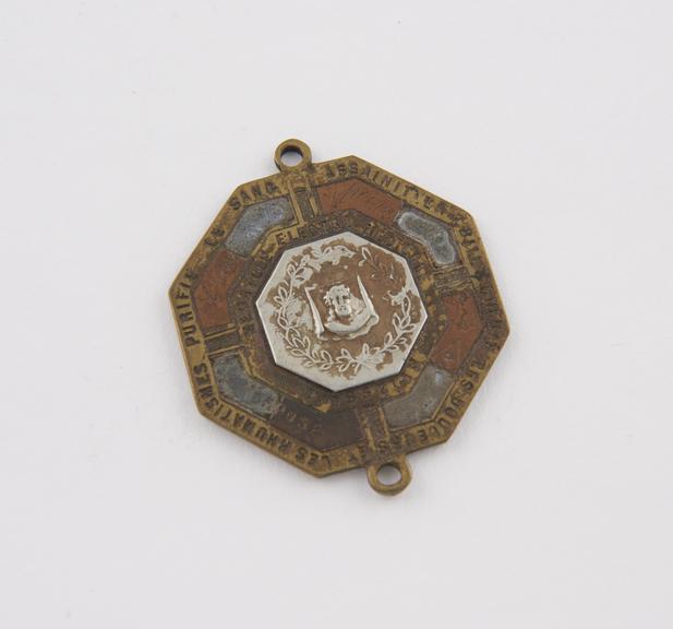 Octagonal, metal medal, used as an amulet, artist unknown