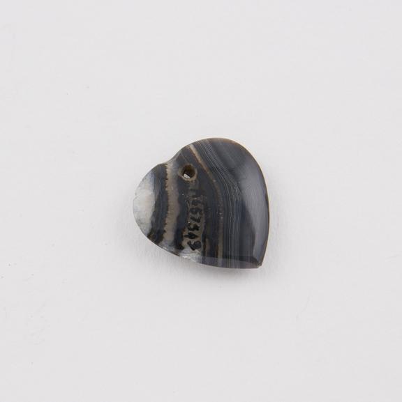 Amuletic pendant, translucent banded grey agate heart