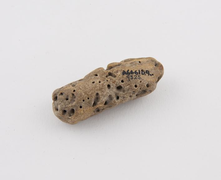 Amulet, holed stone which brings wealth