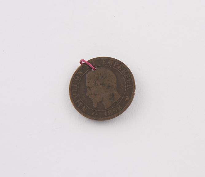 Bronze five centimes piece, perforated