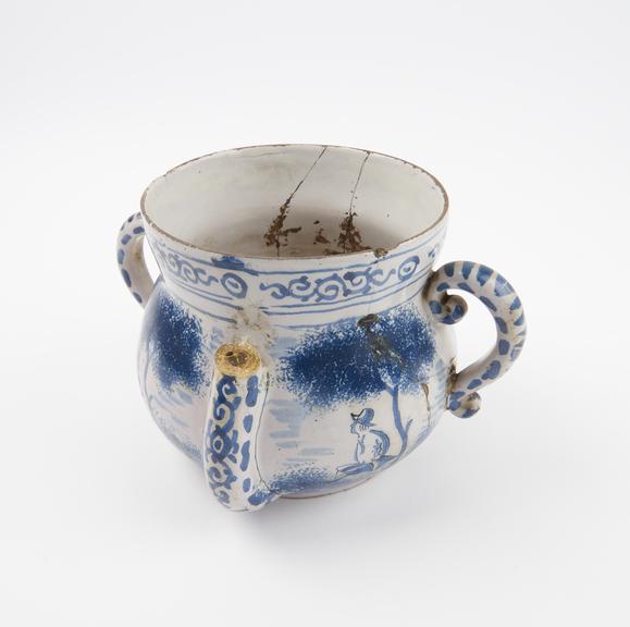 Tin glazed earthenware posset pot, with pastoral scenes