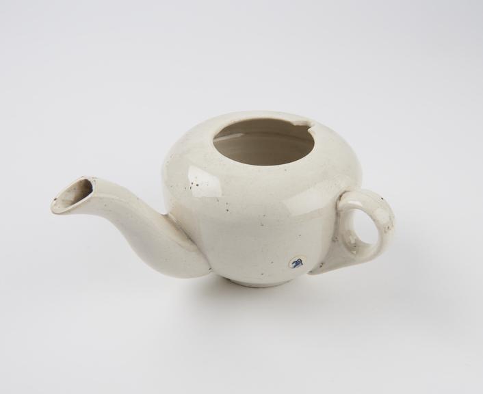 Cream earthenware feeding cup with domed top and circular