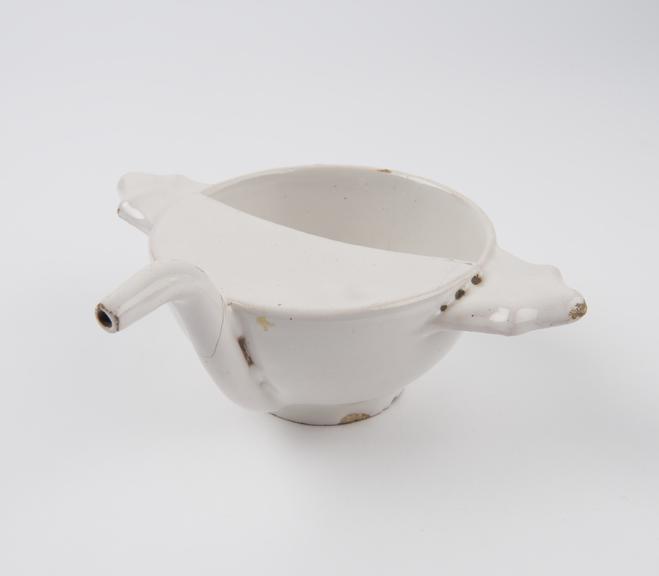 Tin glazed earthenware two handled feeding cup, English(?)