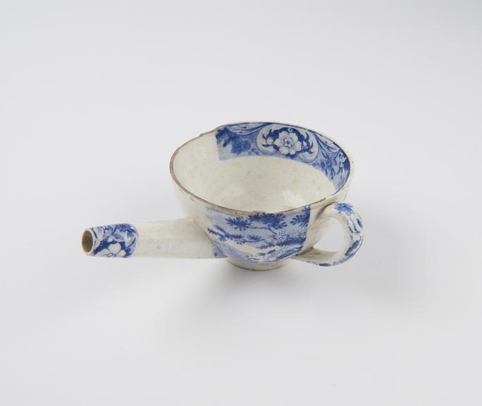 Blue and white transfer pattern feeding cup, half cover missing