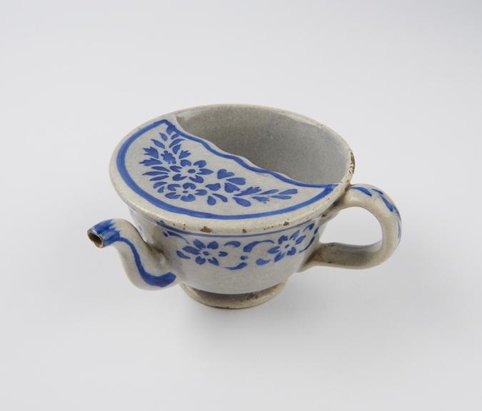 Tin glazed earthenware invalid feeding cup with blue decoration