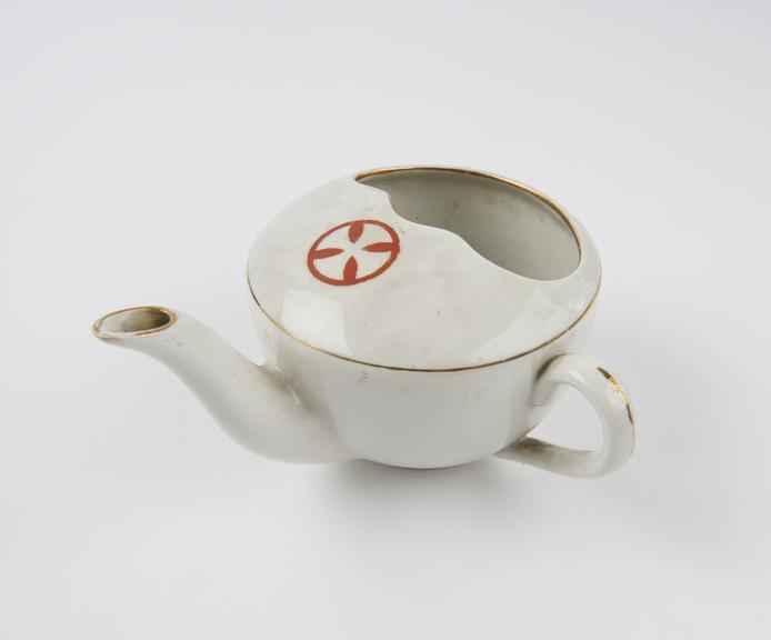 White china invalid feeding cup with red Maltese cross