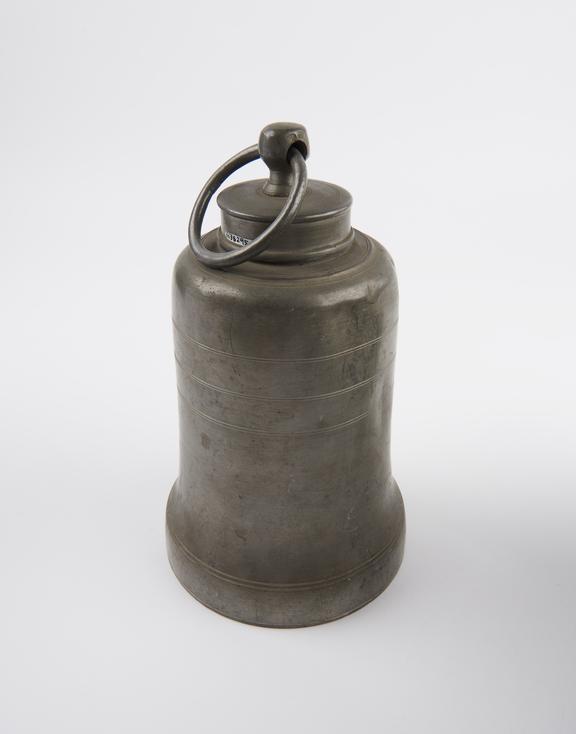 Bell shaped pewter hot water bottle with screw cap and ring