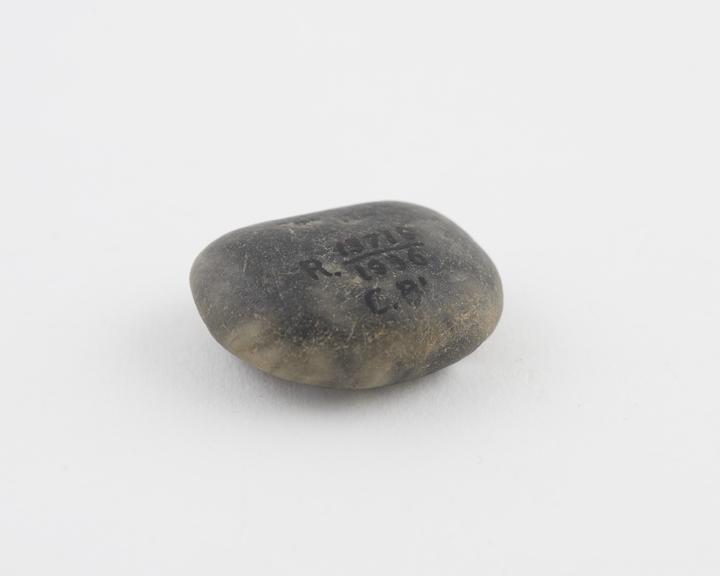 Pebble amulet, dark grey and white, to cure headache