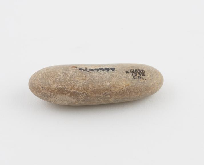 Stone charm, rounded pebble high in silicate content