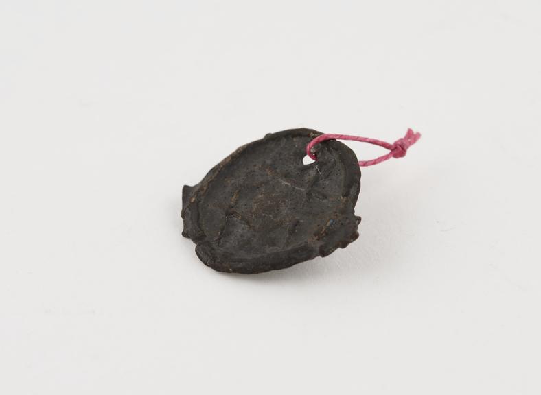 Small crude bronze coin said to bear seal of Solomon, very worn