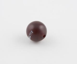 Plastic amber coloured bead