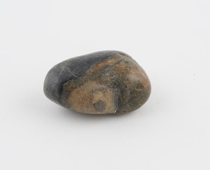 Grey stone for curing pain and swollen veins above the breast