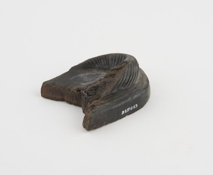 Black pottery foot scraper