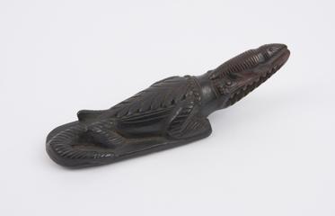 Black earthenware foot-scraper in the form of a crocodile