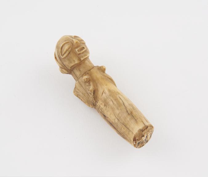 Ivory ancestral figure carved from the tip of a hippopotamus