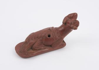 Red earthenware foot scraper, sheep or dog