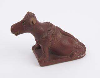 Red earthenware skin/foot scraper with handle in the form of a crouching dog