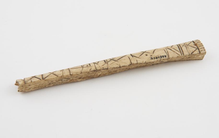 Amuletic bone with incised linear design originally attached to hand of Fatima