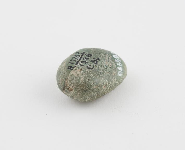 Pale green stone amulet, cure for pain in the knee