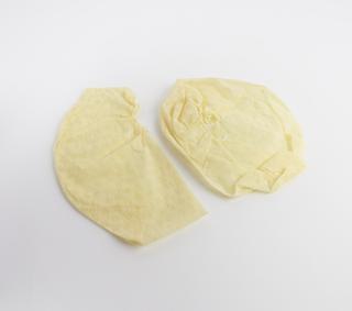 Yellow nurses' disposable theatre caps